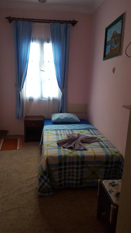 Postel nebo postele na pokoji v ubytování GökMavi Pansiyon