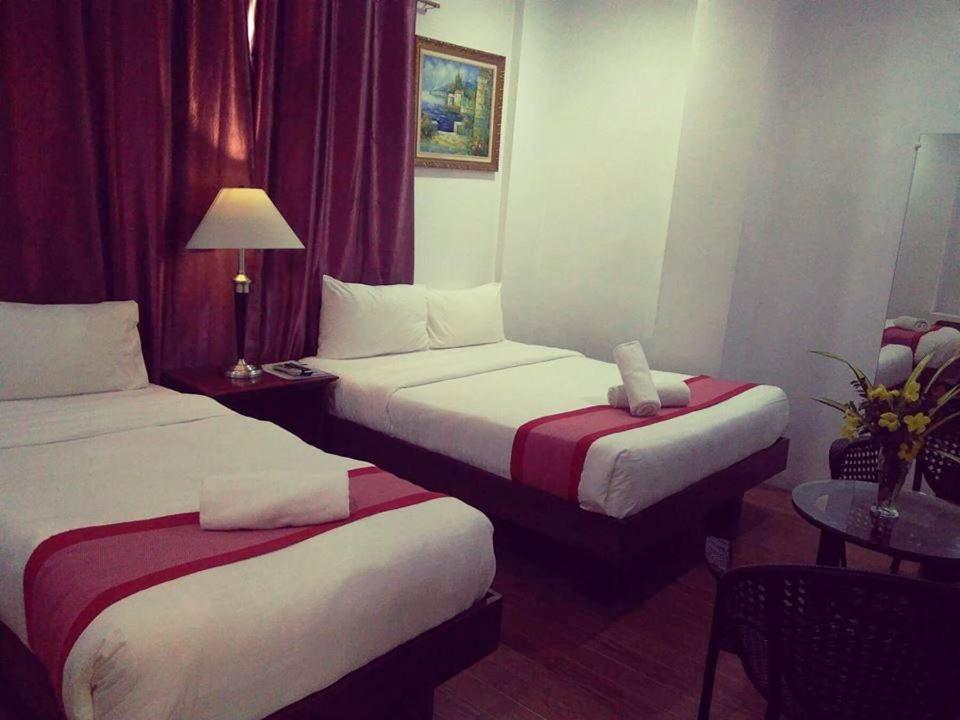 Postel nebo postele na pokoji v ubytování Discover Boracay Hotel