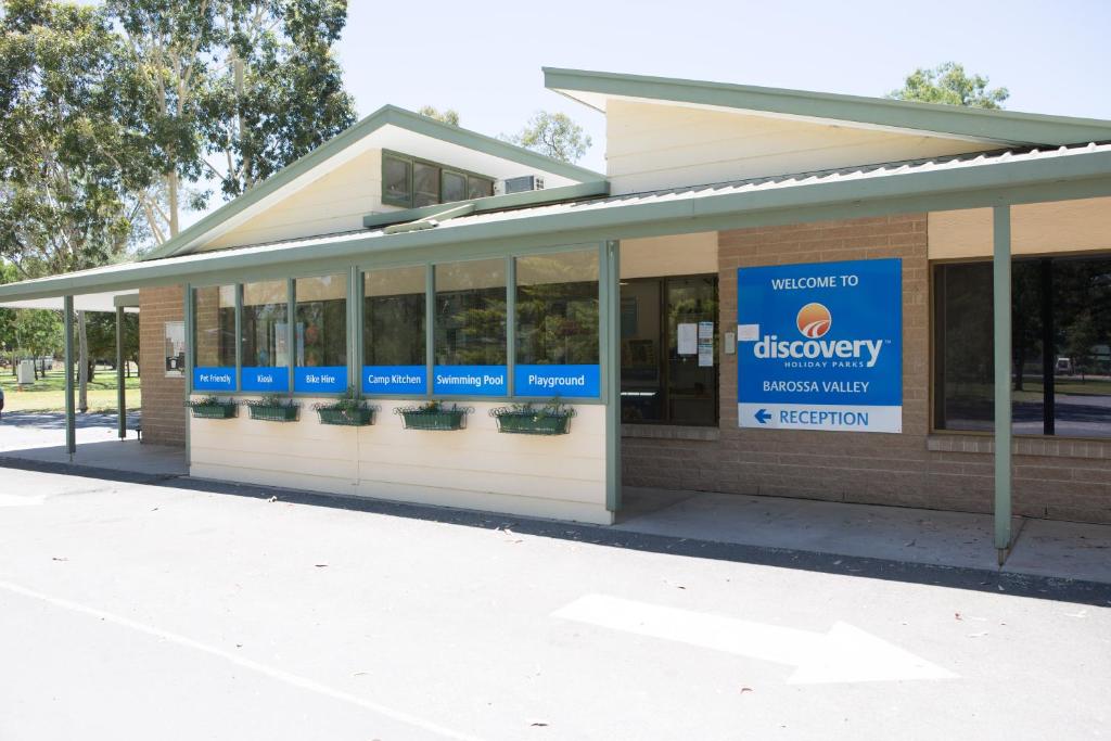 a building with a sign on the side of it at Discovery Parks - Barossa Valley in Tanunda