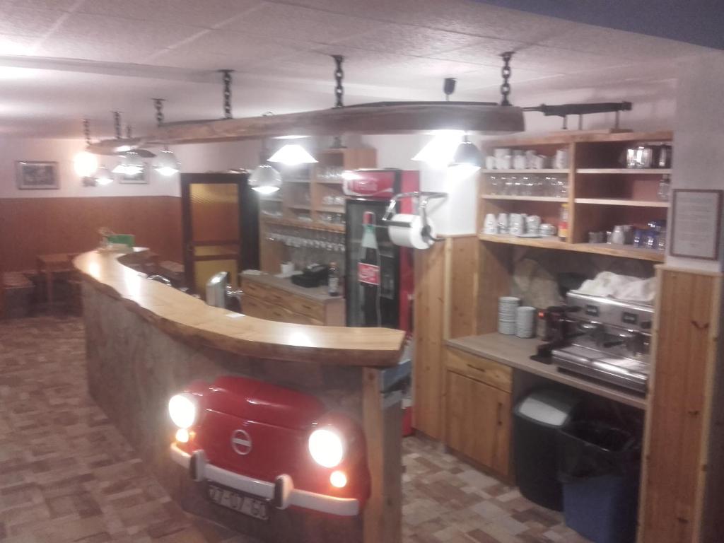 a kitchen with a red toy car on the counter at Turistična kmetija Široko in Tolmin