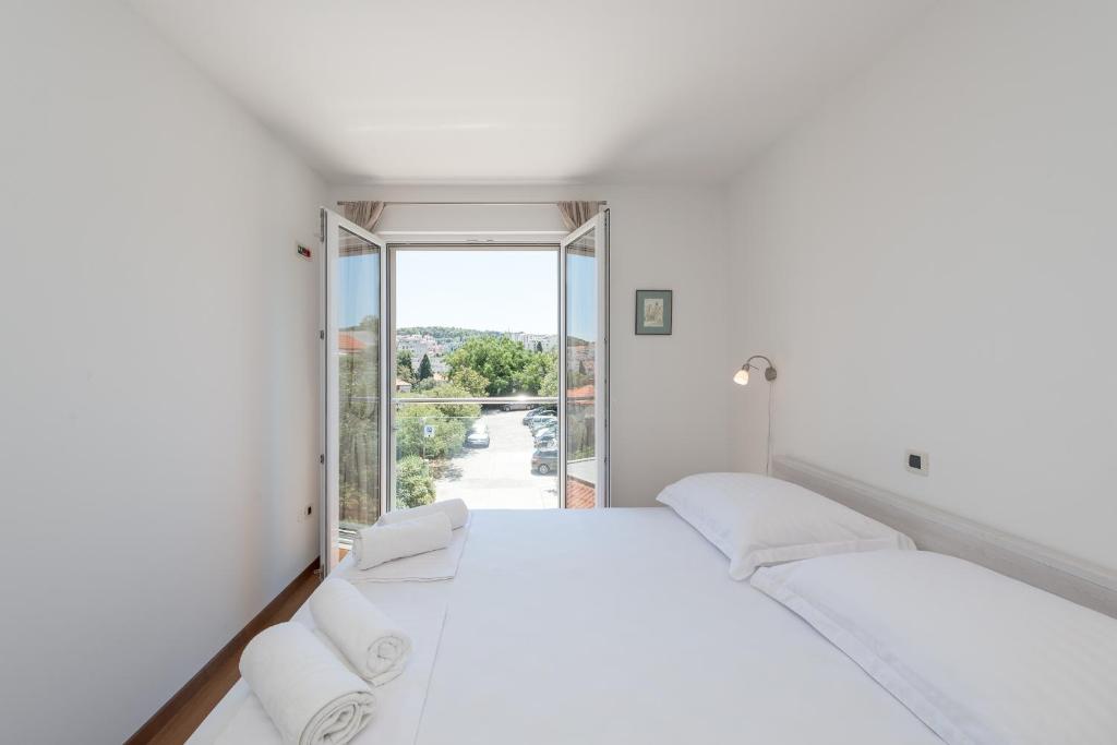 Posteľ alebo postele v izbe v ubytovaní Apartment Maro Bayview
