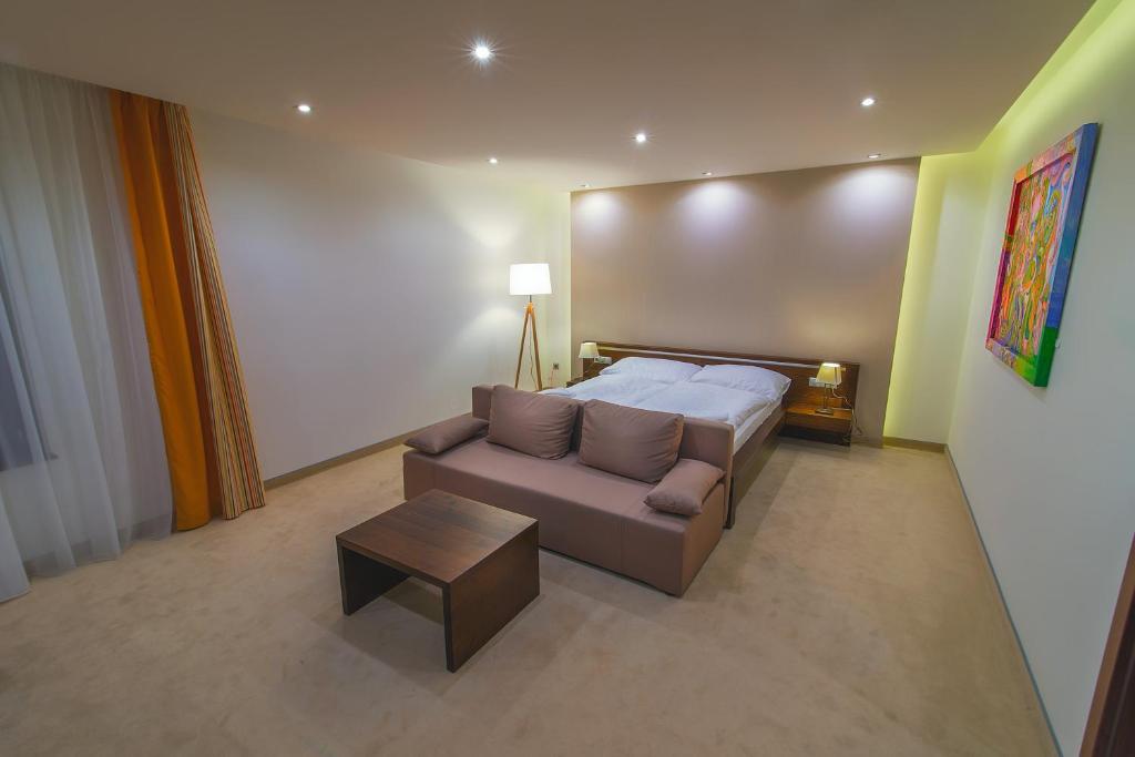 Postel nebo postele na pokoji v ubytování Hotel Arkada