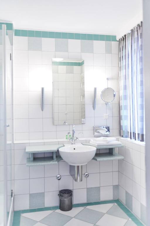 Koupelna v ubytování Hotel Amadeus