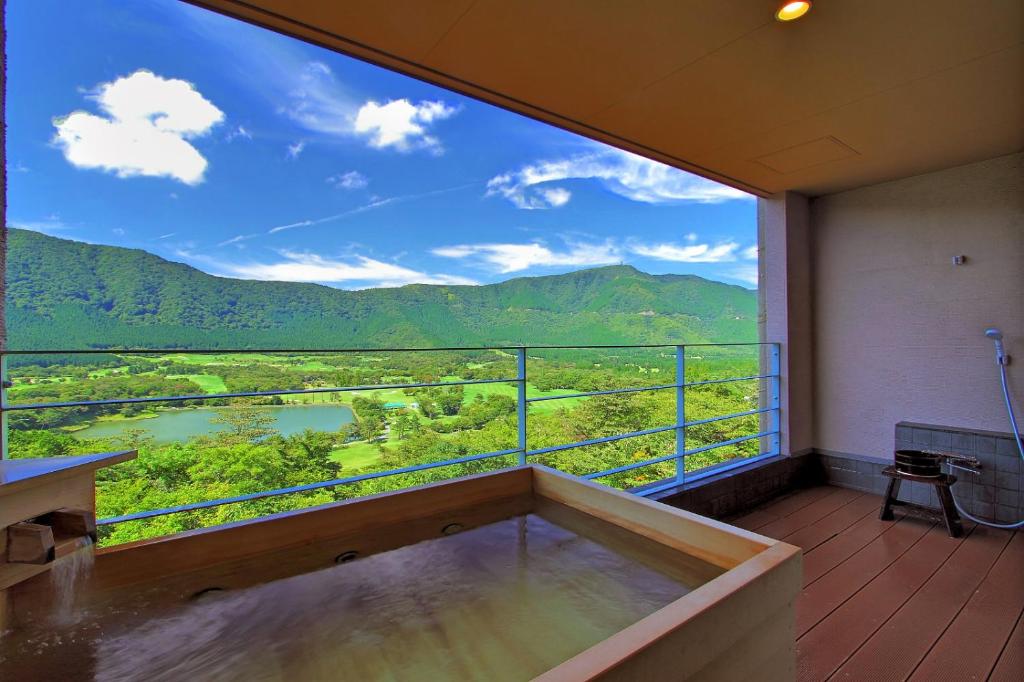 a room with a large window with a view at Hakone Hoshi no Akari in Hakone