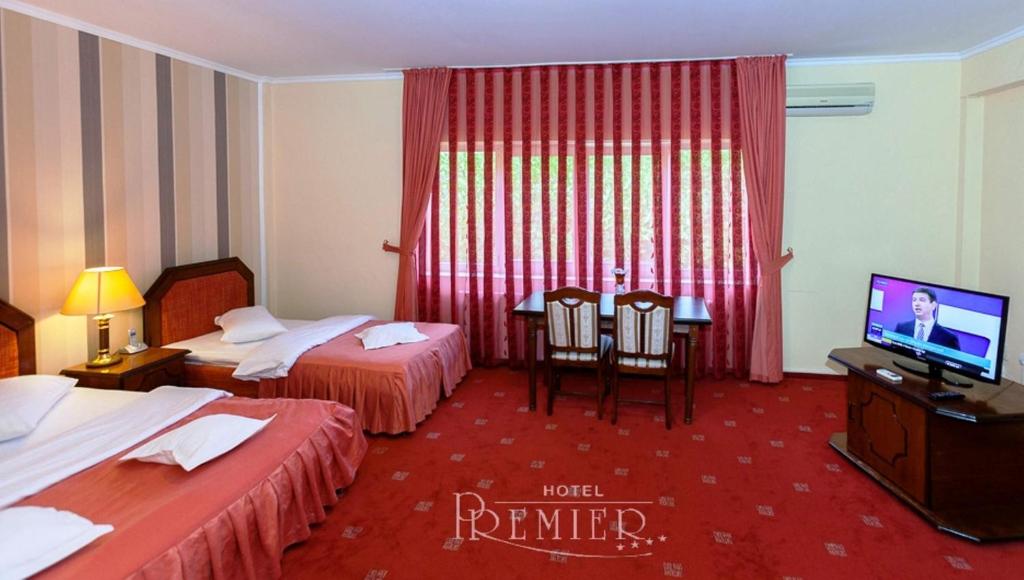 Postel nebo postele na pokoji v ubytování Hotel Premier