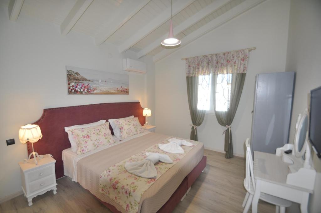 A bed or beds in a room at Agios Gordios Stevens on the hill