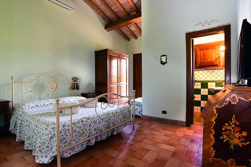 A bed or beds in a room at Il Collicello