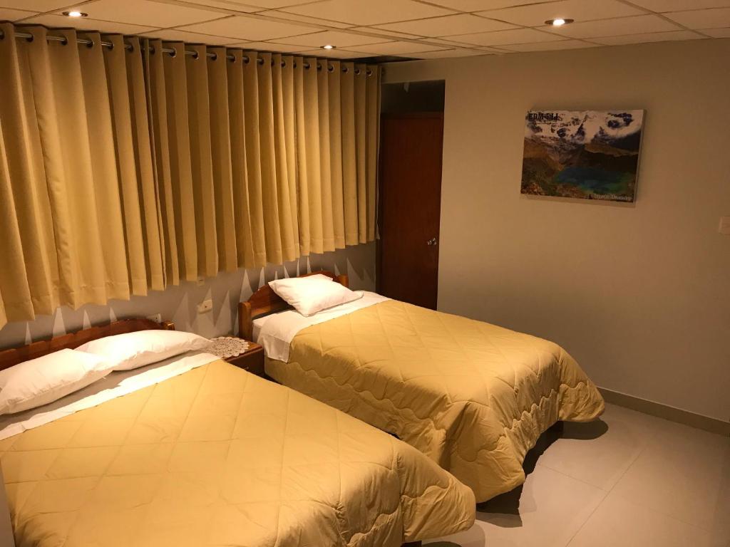 Postel nebo postele na pokoji v ubytování Edmoli Casa Hospedaje