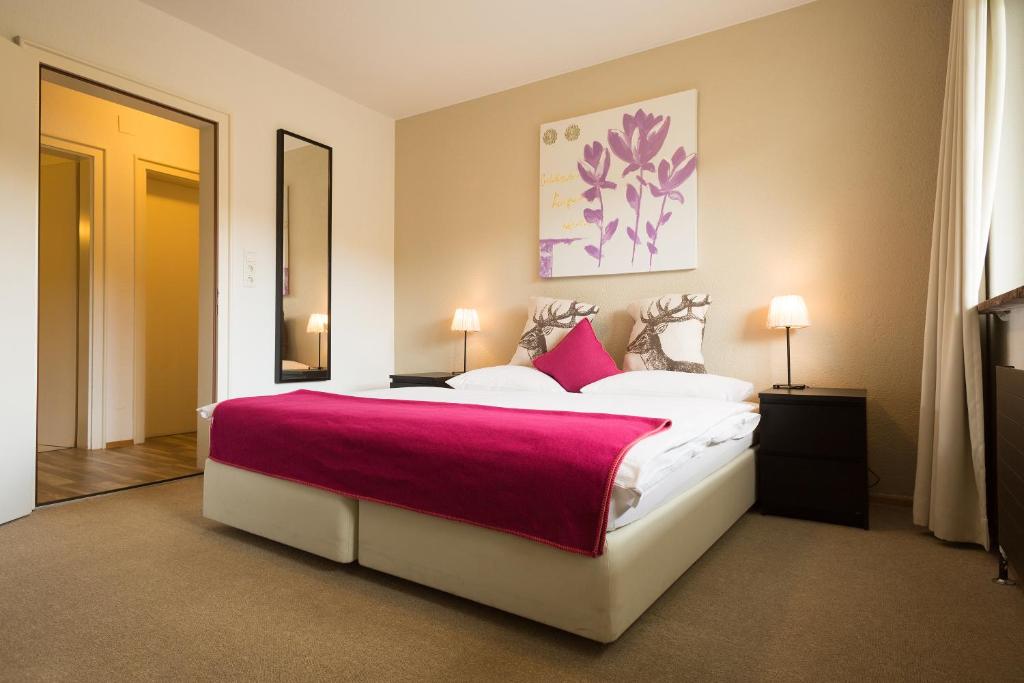 Postel nebo postele na pokoji v ubytování Hotel Garni Römerhof