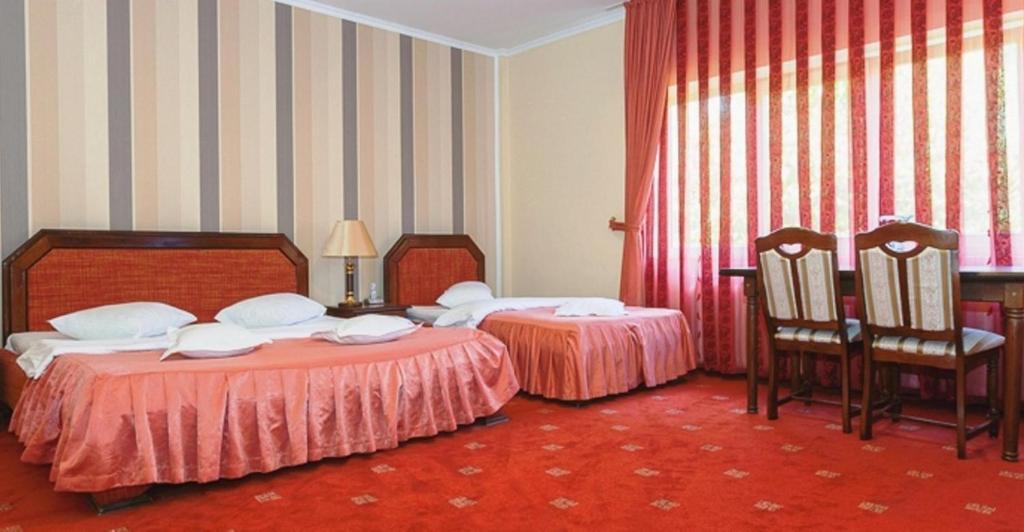 Postel nebo postele na pokoji v ubytování Hotel Premier
