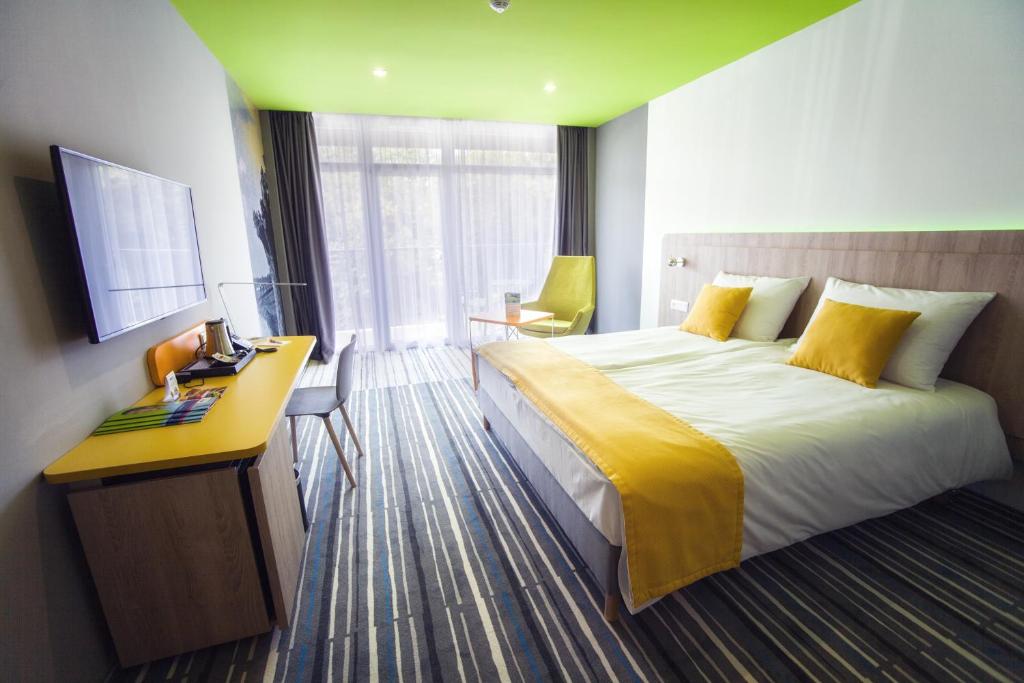Postel nebo postele na pokoji v ubytování Park Inn By Radisson Zalakaros Hotel & Spa