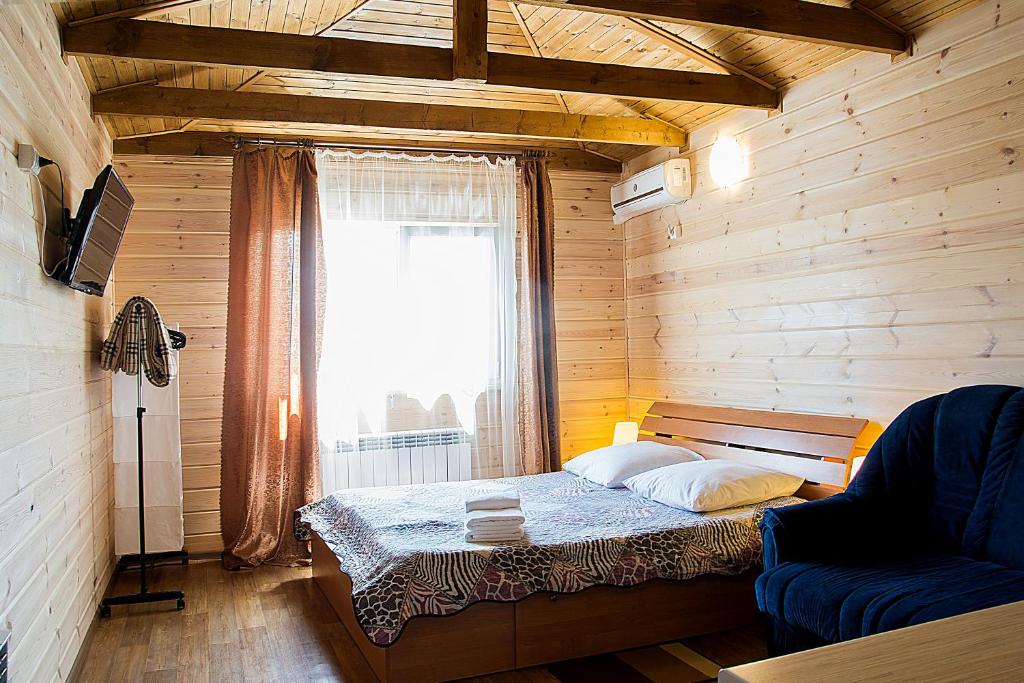 Ένα ή περισσότερα κρεβάτια σε δωμάτιο στο Мини-отель Матрешка