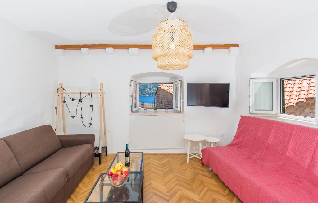 Televízia a/alebo spoločenská miestnosť v ubytovaní Seagull Apartment