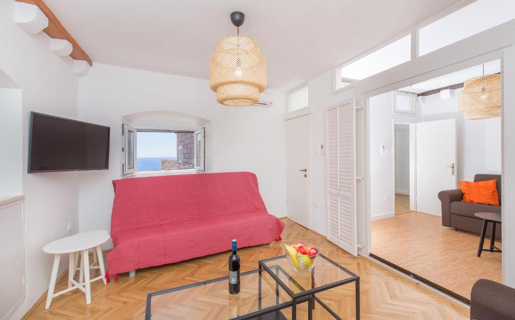 Televízia a/alebo spoločenská miestnosť v ubytovaní Seagull Apartment