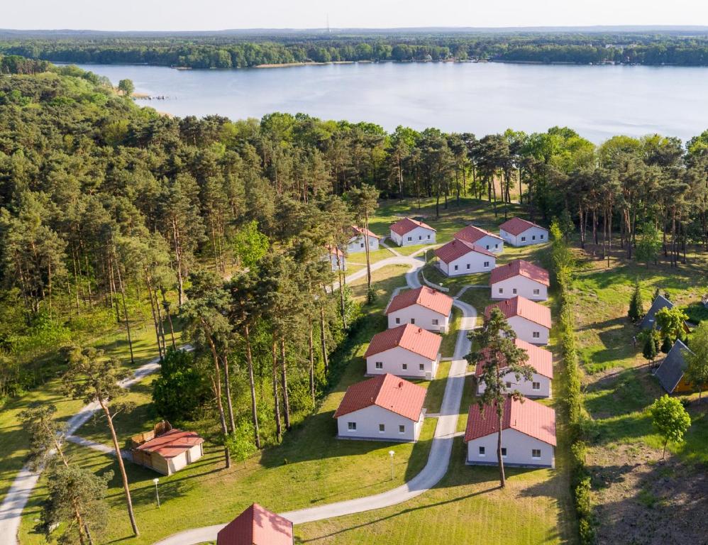 an aerial view of a village on the shore of a lake at Seepark Wolfswinkel in Storkow