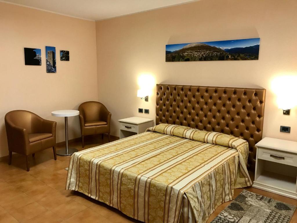 Postel nebo postele na pokoji v ubytování Hotel Ristorante Combolo