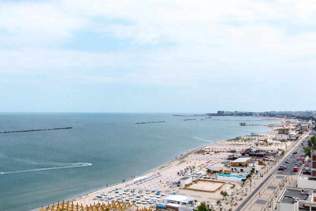 an aerial view of a beach with a crowd of people at Hotel Riviera in Mamaia