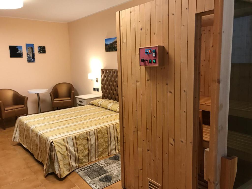 Postel nebo postele na pokoji v ubytování Hotel Ristorante Combolo