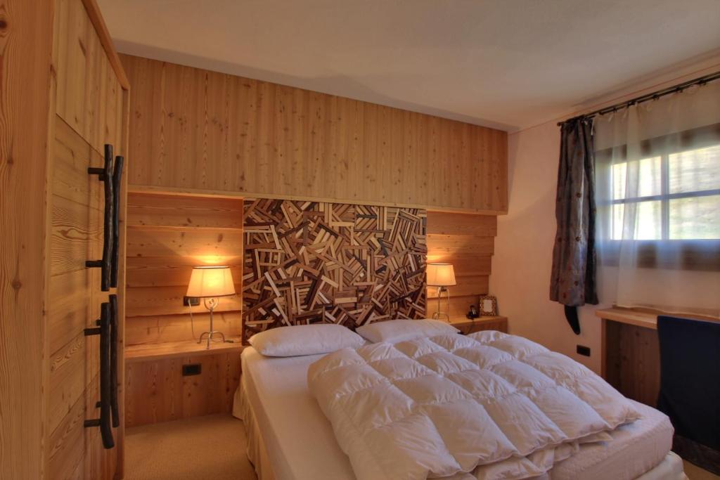 Postel nebo postele na pokoji v ubytování Hotel Bait de Angial