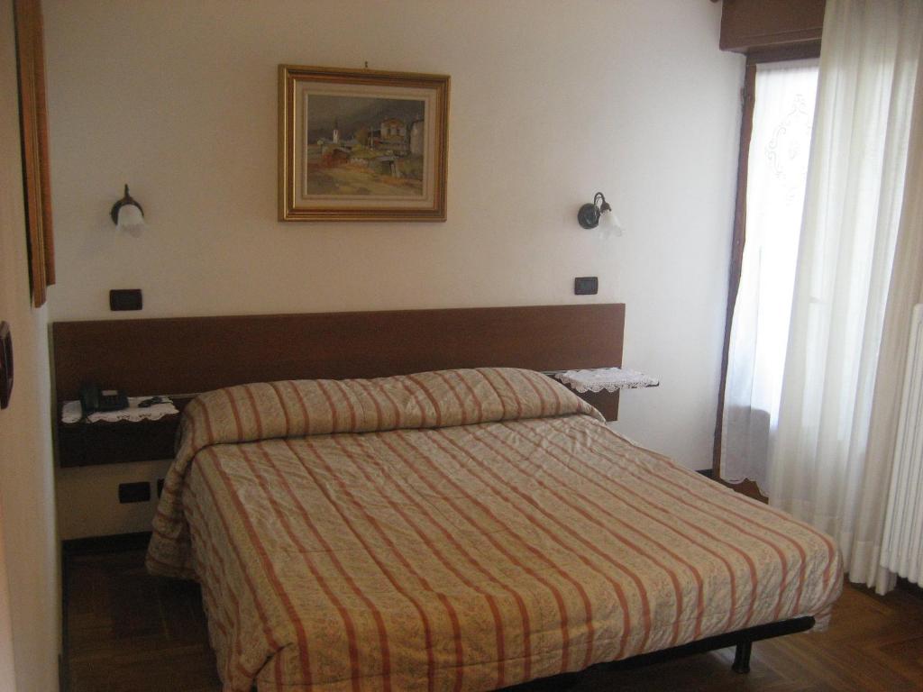 Postel nebo postele na pokoji v ubytování Albergo Castello da Bonino