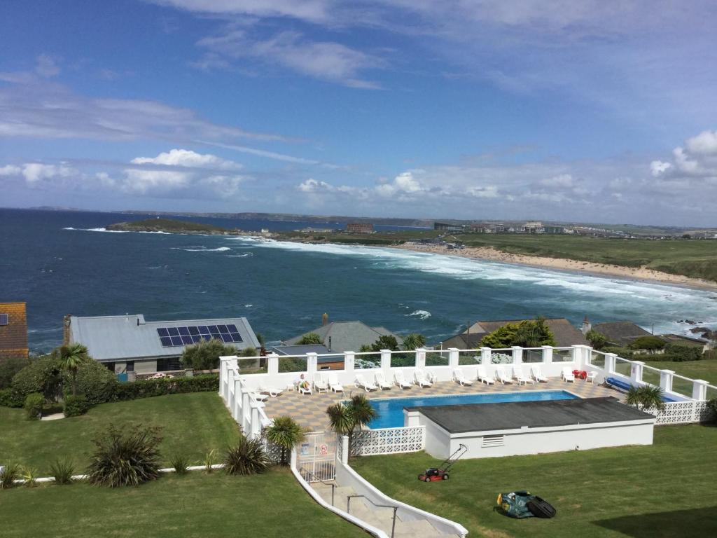 an aerial view of a house and the ocean at Surf View Apartments in Newquay