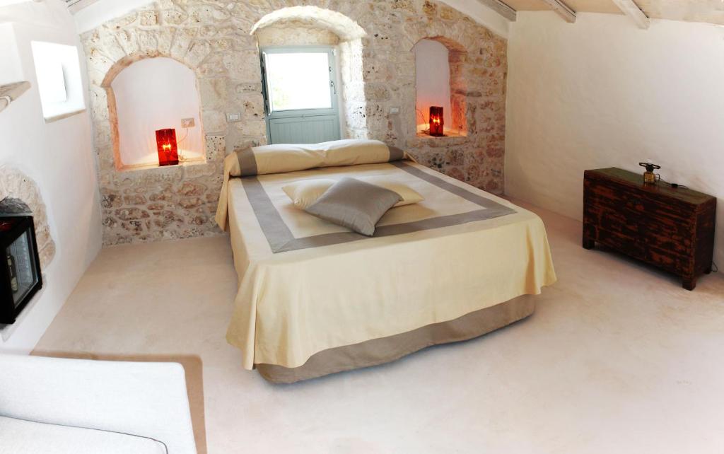 Postel nebo postele na pokoji v ubytování Palazzo Camarda B&B