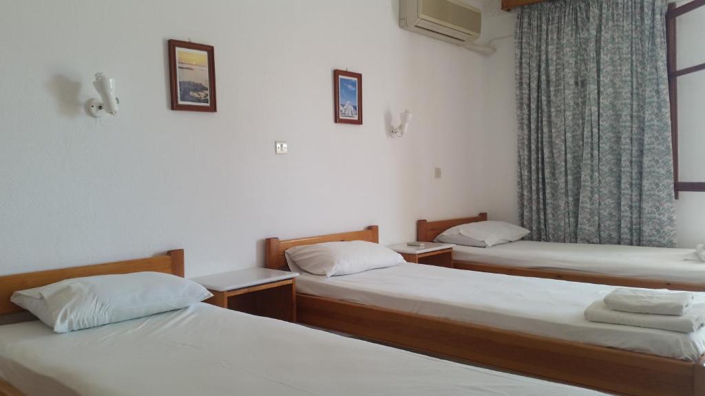 Voodi või voodid majutusasutuse Rubini Rooms toas