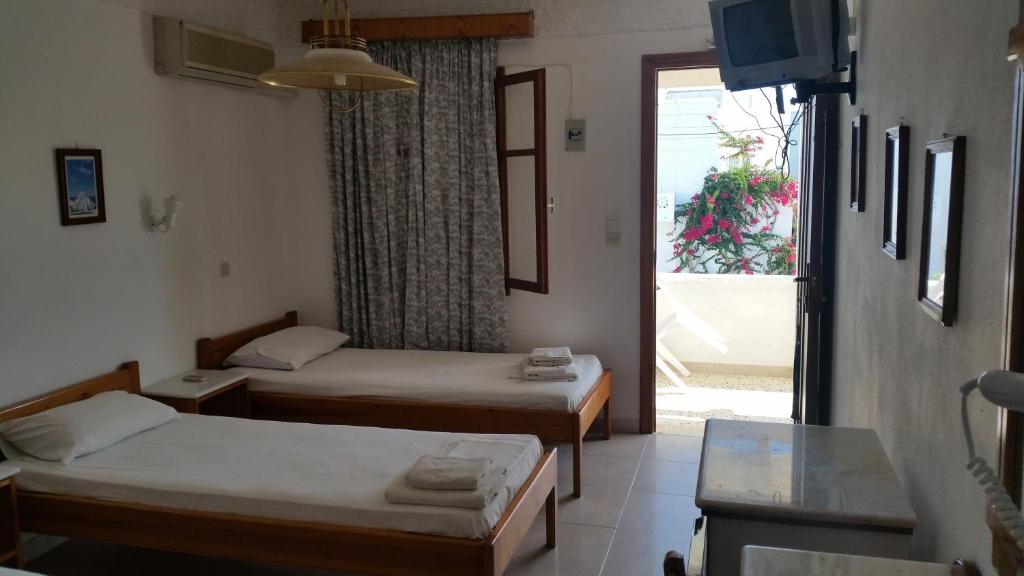 Voodi või voodid majutusasutuse Rubini Rooms toas