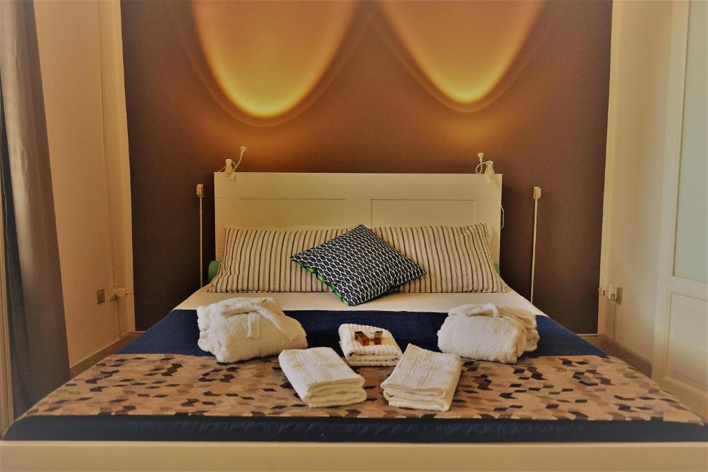 Ліжко або ліжка в номері Dietro al Massimo