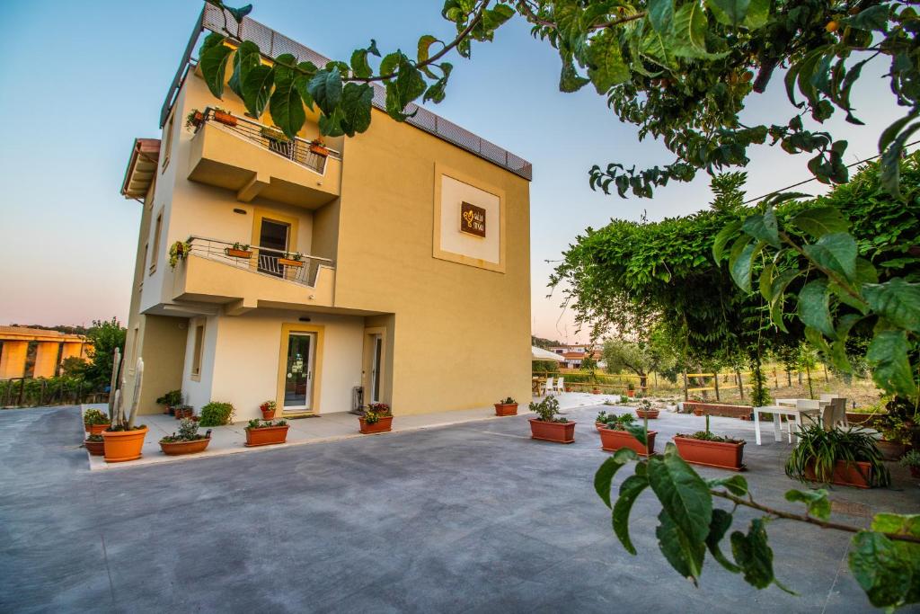 a building with potted plants in front of it at Il Gallo Con Gli Stivali in Termoli