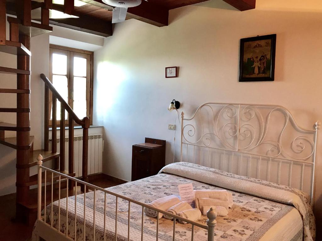 Posteľ alebo postele v izbe v ubytovaní Agriturismo Villani Poderi Nesti & Cupoli