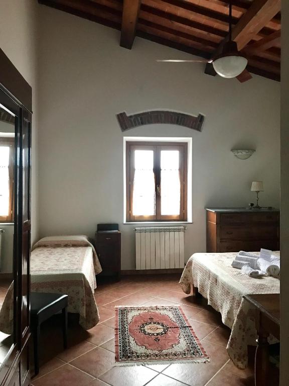 Posteľ alebo postele v izbe v ubytovaní Agriturismo Villani Poderi Nesti & Cupoli