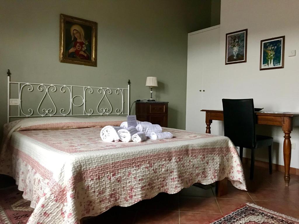 Posteľ alebo postele v izbe v ubytovaní Agriturismo Villani Poderi Nesti & Cupoli