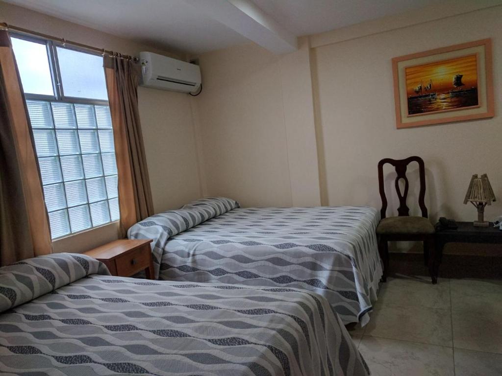 Postel nebo postele na pokoji v ubytování Hotel Mileto