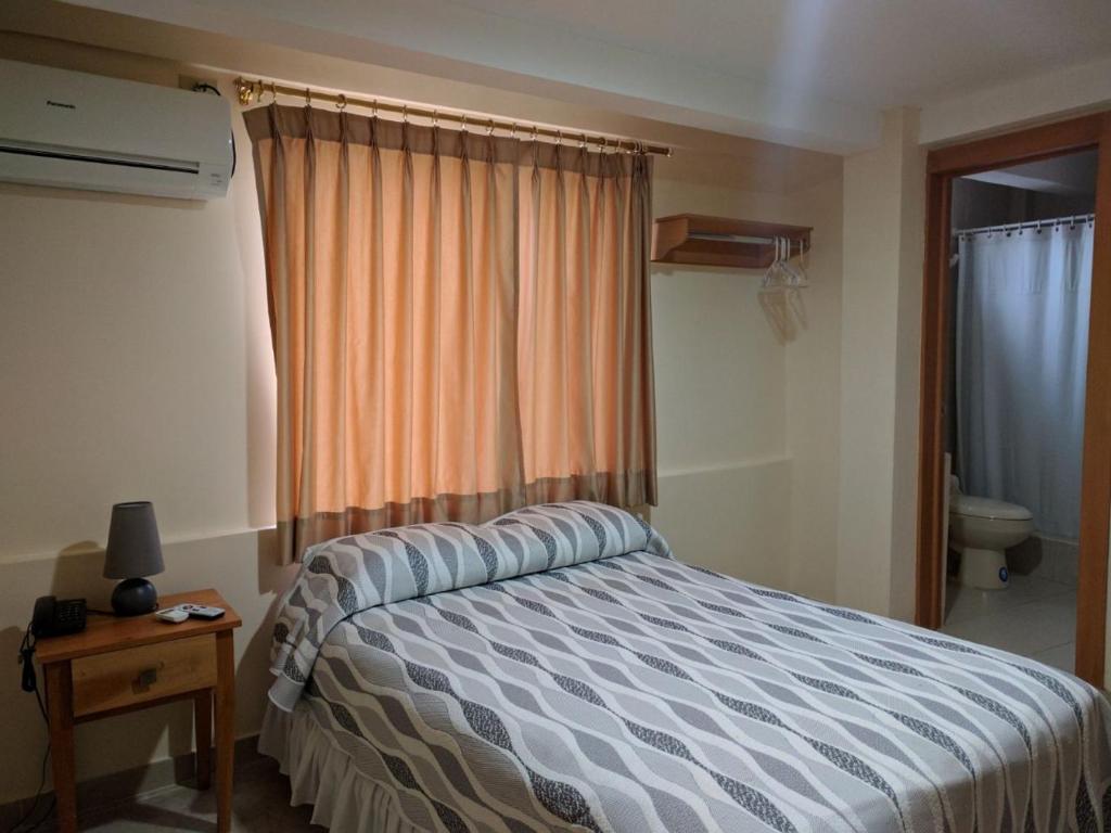 Postel nebo postele na pokoji v ubytování Hotel Mileto