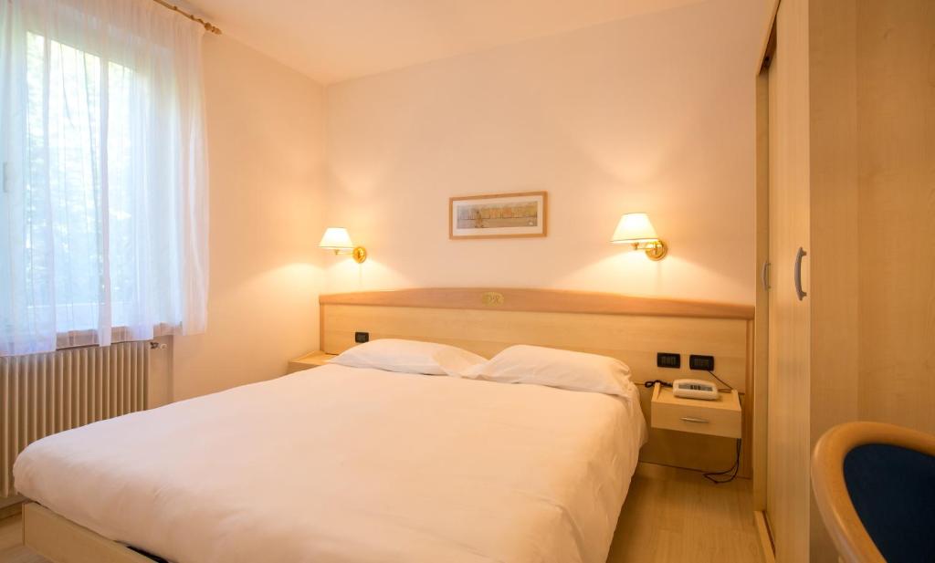 Postel nebo postele na pokoji v ubytování Hotel Da Remo