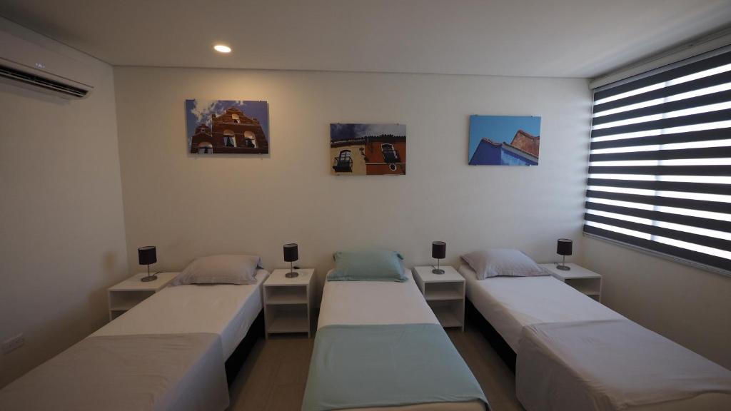 Postel nebo postele na pokoji v ubytování Hotel Casa Cytia