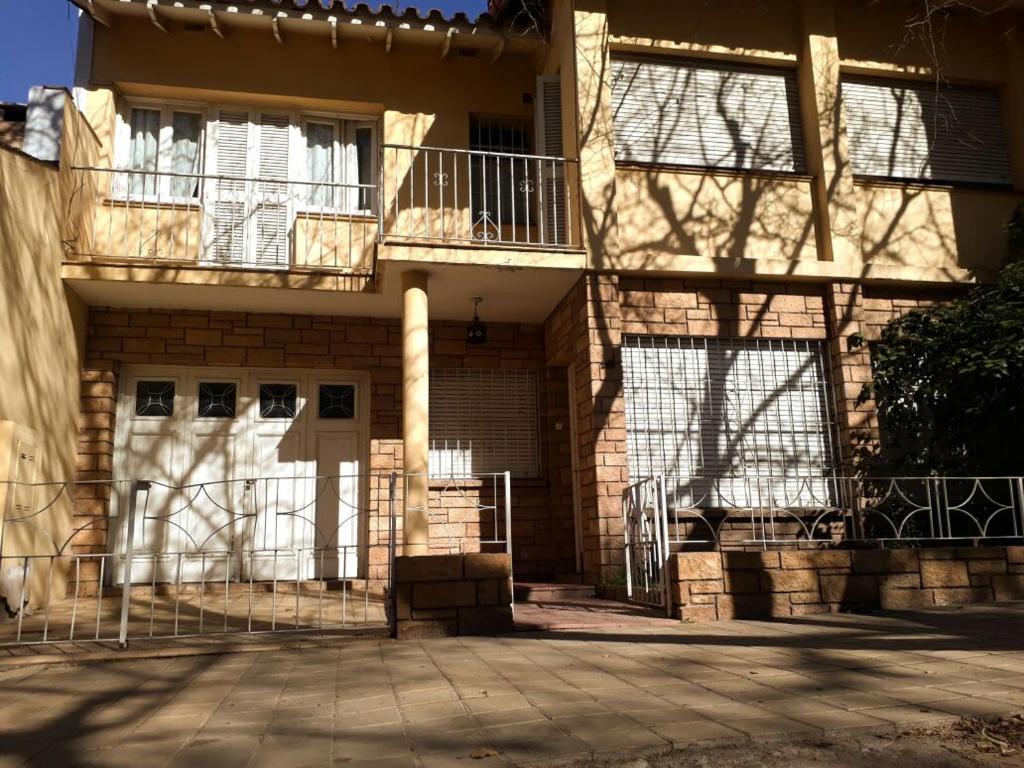 a building with two balconies on the side of it at Silvia in Mendoza