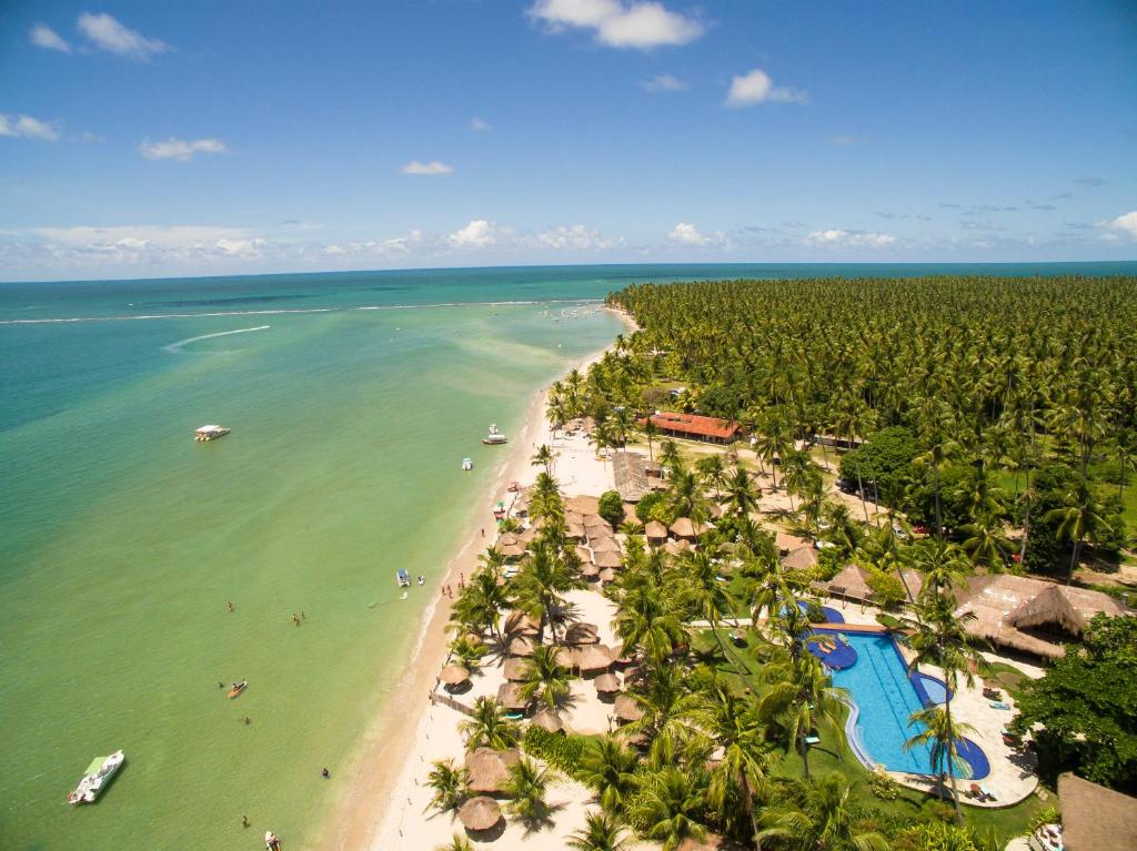 an aerial view of a beach with a resort at Pousada Praia dos Carneiros in Praia dos Carneiros