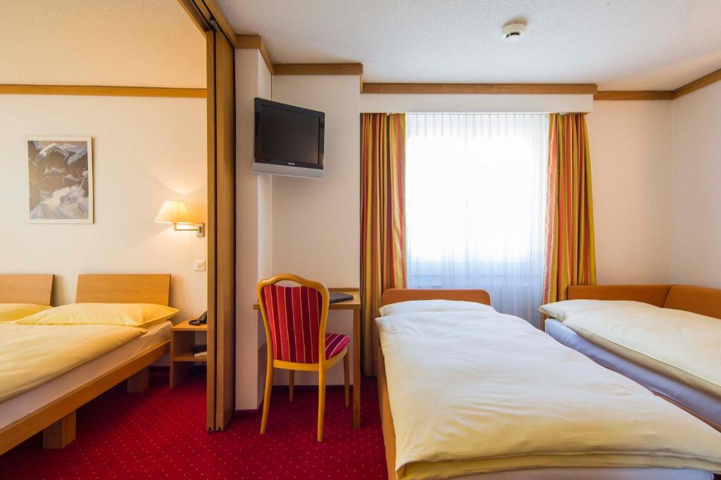 Postel nebo postele na pokoji v ubytování Hotel Excelsior