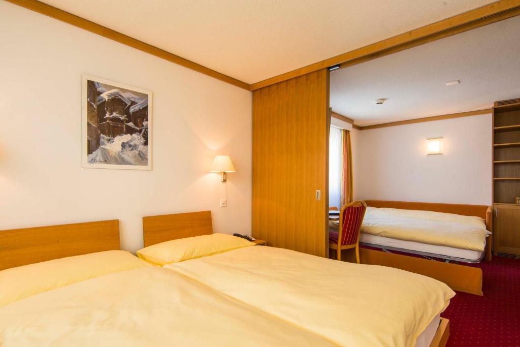 Postel nebo postele na pokoji v ubytování Hotel Excelsior