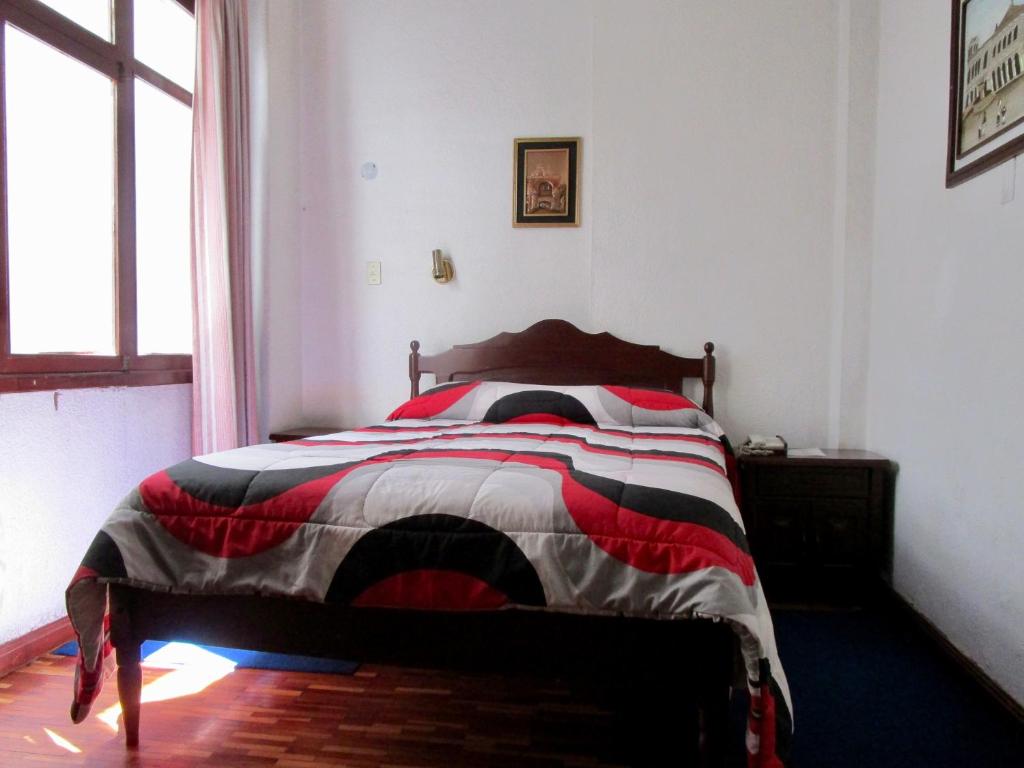 Postel nebo postele na pokoji v ubytování Hotel Huasi Continental