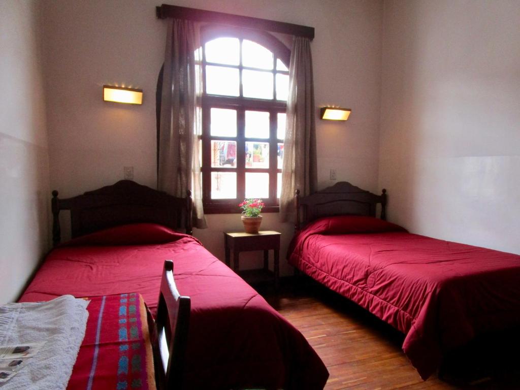 Postel nebo postele na pokoji v ubytování Hotel Huasi Continental