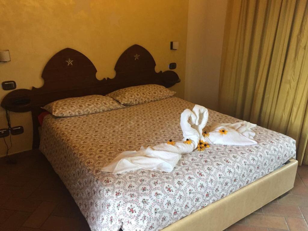 Postel nebo postele na pokoji v ubytování Agriturismo La Pecora Nera