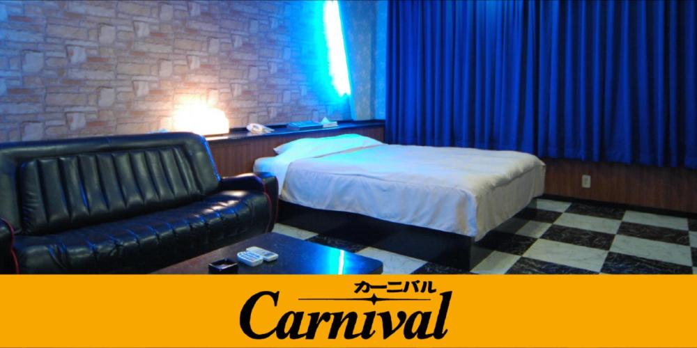 Kama o mga kama sa kuwarto sa Hotel Carnival (Love Hotel)