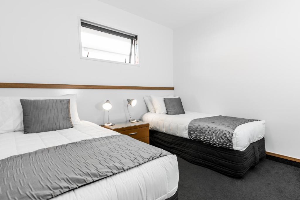 Voodi või voodid majutusasutuse Palms Motel toas