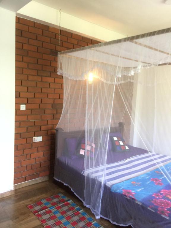 Postel nebo postele na pokoji v ubytování Rock side inn - Ella