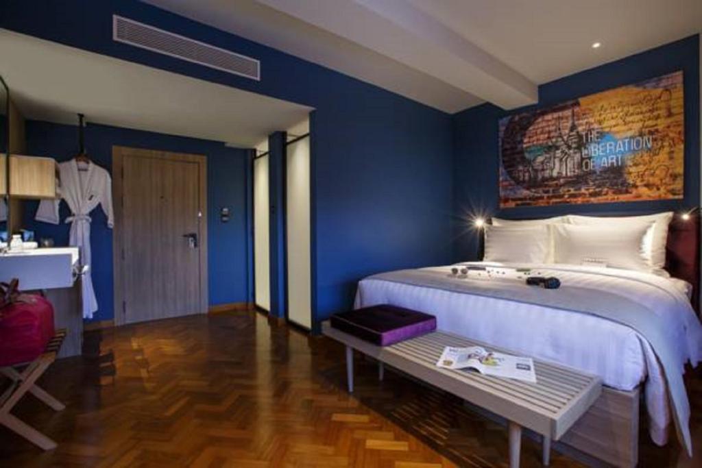 Postel nebo postele na pokoji v ubytování Hotel G Yangon