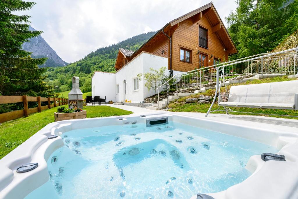 a hot tub in the backyard of a house at Haus Edelweiss in Brand