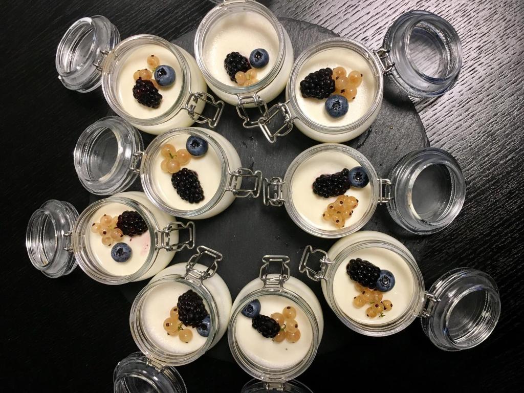a bunch of dishes of food in glasses at Residenza RoMa in Tropea